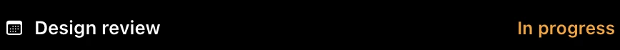 The closed MacBook notch widened into a black strip that reads Design review on the left and In progress in orange on the right